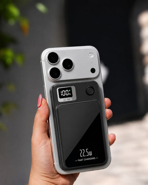 VoltSnap magnetic power bank attached to a phone in hand